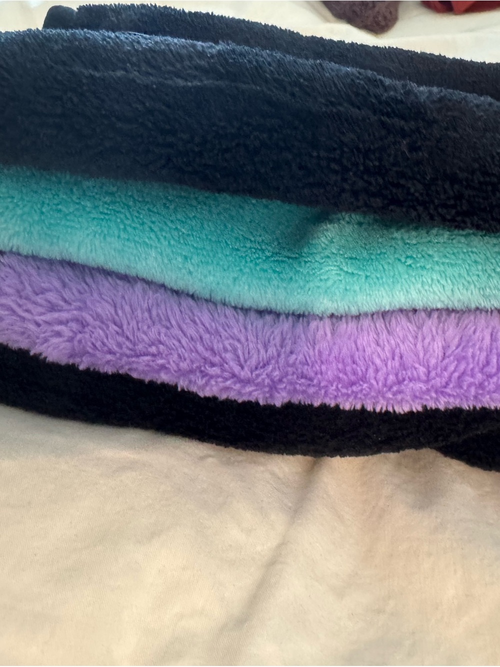 MakeUp Eraser  in Black, Teal, and Lavender